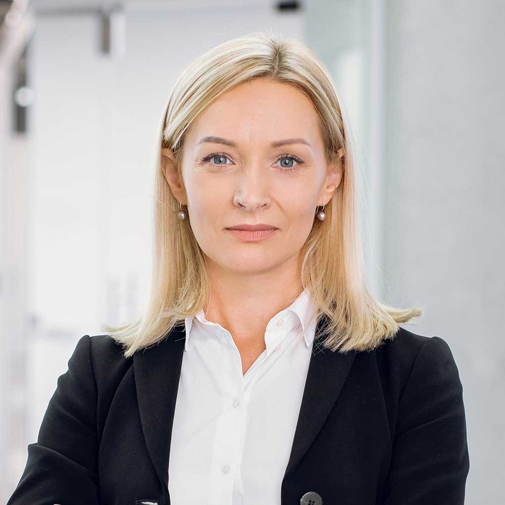 indoor-office-portrait-of-pretty-mature-blond-busi-PAPVH57.jpg